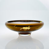 Amber glass bowl with splatter effect on a connected stand. Designer glass bowl with metal coating. Mirror effect glass bowl.