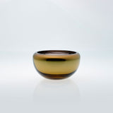 Small amber round glass bowl with interior metal coating. Mirror glass effect bowl.