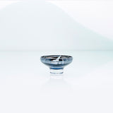 Blue glass mirror bowl with splashes and metal coating interior. Design dessert dish.