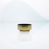 Mini, flat disk glass dessert or snack bowl in amber with metal interior coating. Designer hand made glass bowl.