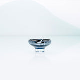 Blue glass mirror bowl with splashes and metal coating interior. Design dessert dish.