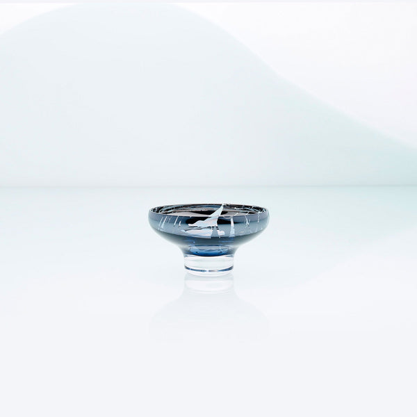 Blue glass mirror bowl with splashes and metal coating interior. Design dessert dish.