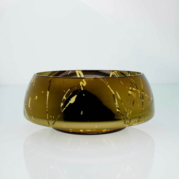 Amber glass round bowl with high tops and splashes. Designer glass bowl with metal coating. Mirror effect glass bowl.