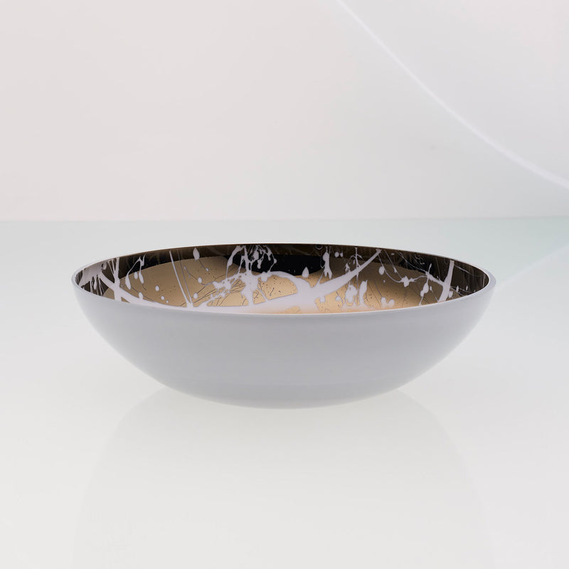 Round white glass fruit bowl with interior titanium coating and splashes. Mirror effect design glass bowl.