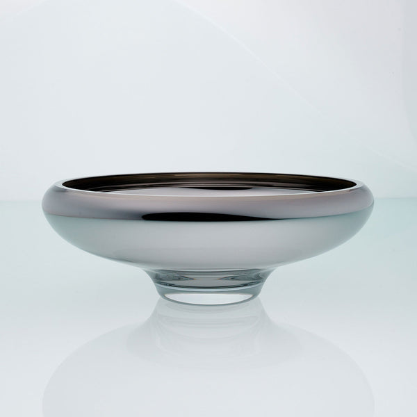 Grey glass bowl on a connected stand. Designer glass bowl with metal coating. Mirror effect glass bowl.