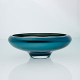 Teal blue glass bowl on a connected stand. Designer glass bowl with metal coating. Mirror effect glass bowl.