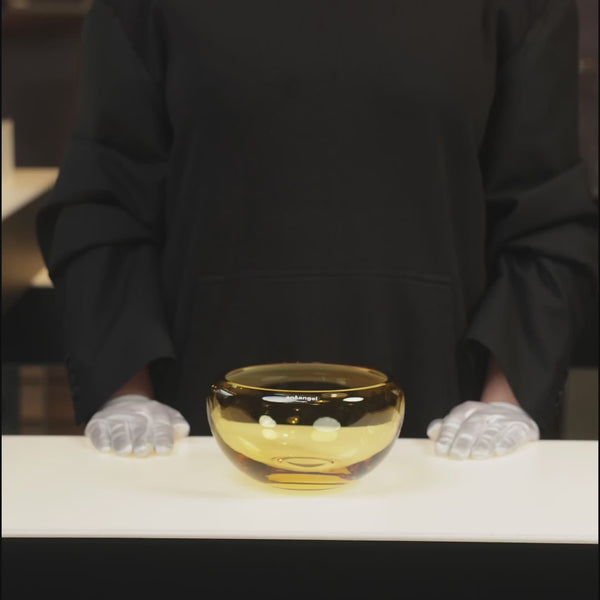 small round translucent amber bowl