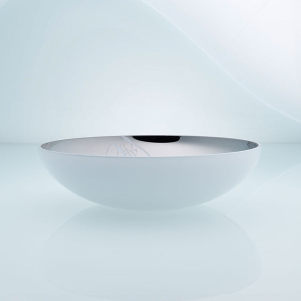 Flat round white glass fruit bowl with interior stainless steel coating and splashes. Mirror effect design glass bowl.