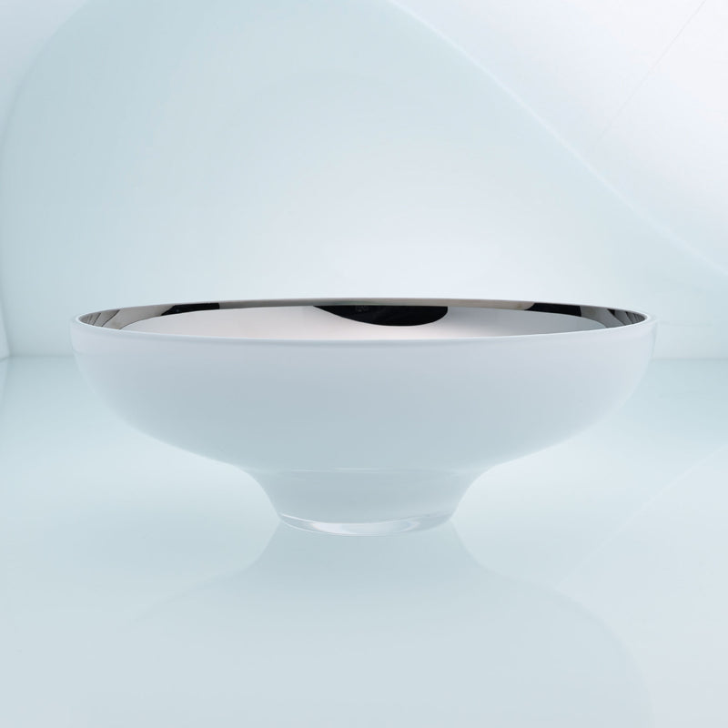 Round white glass fruit bowl on a stand with interior stainless steel coating. Mirror effect design glass bowl.