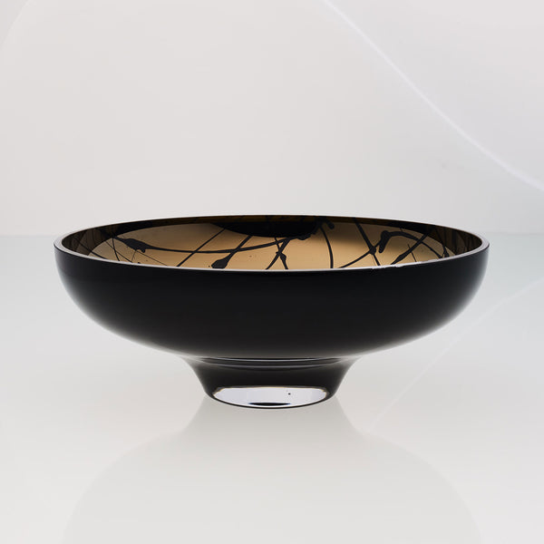 Round black glass fruit bowl on a stand with interior titanium coating and splashes. Mirror effect design glass bowl.