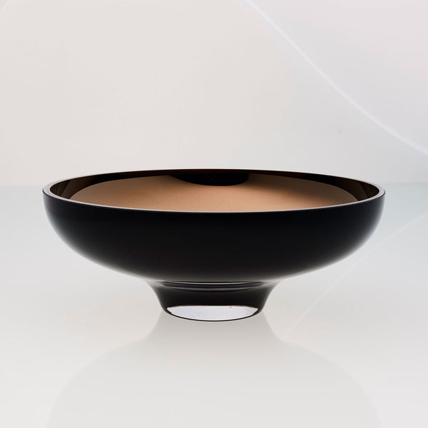 Round black glass fruit bowl on a stand with interior titanium coating. Mirror effect design glass bowl.