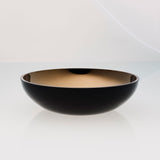 Round black glass fruit bowl with interior titanium coating. Mirror effect design glass bowl.